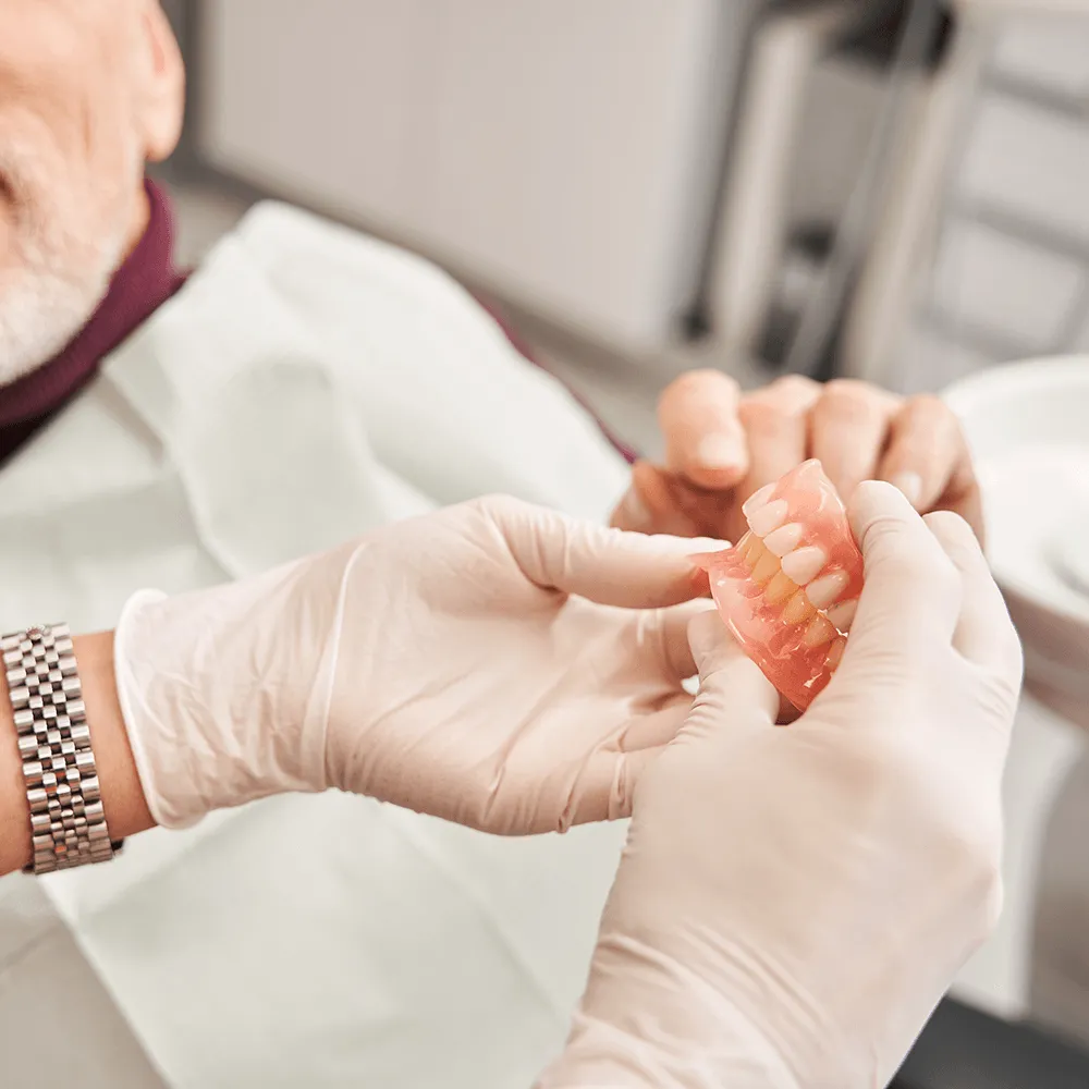 Dentist showing dentures.